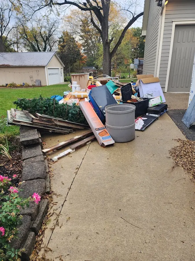 Dumpster being loaded with debris for Commercial Dumpster Rental in Evergreen Park